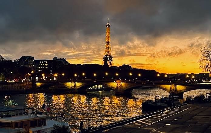 The Eiffel Tower from the Seine at sunset